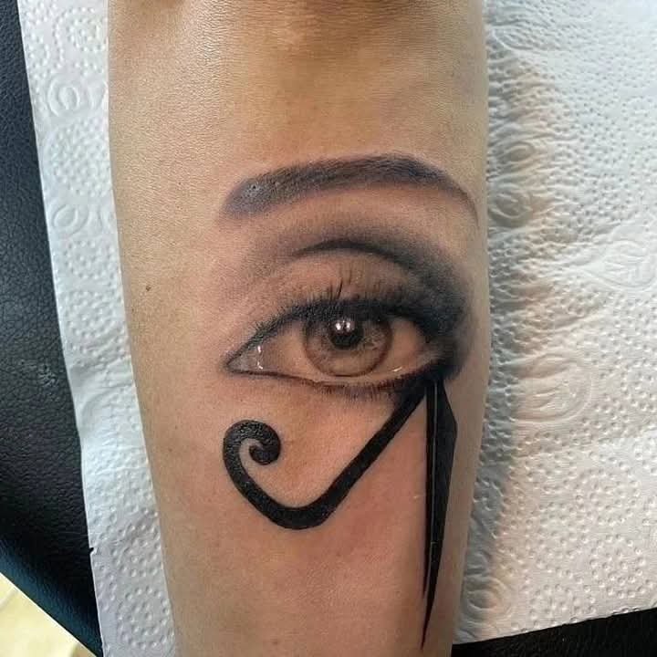Black and grey realistic eye with Eye of Horus tattoo design